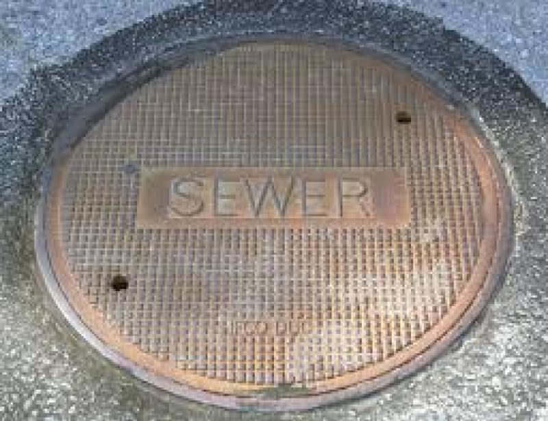 Man hole lid being "lifted" by rains