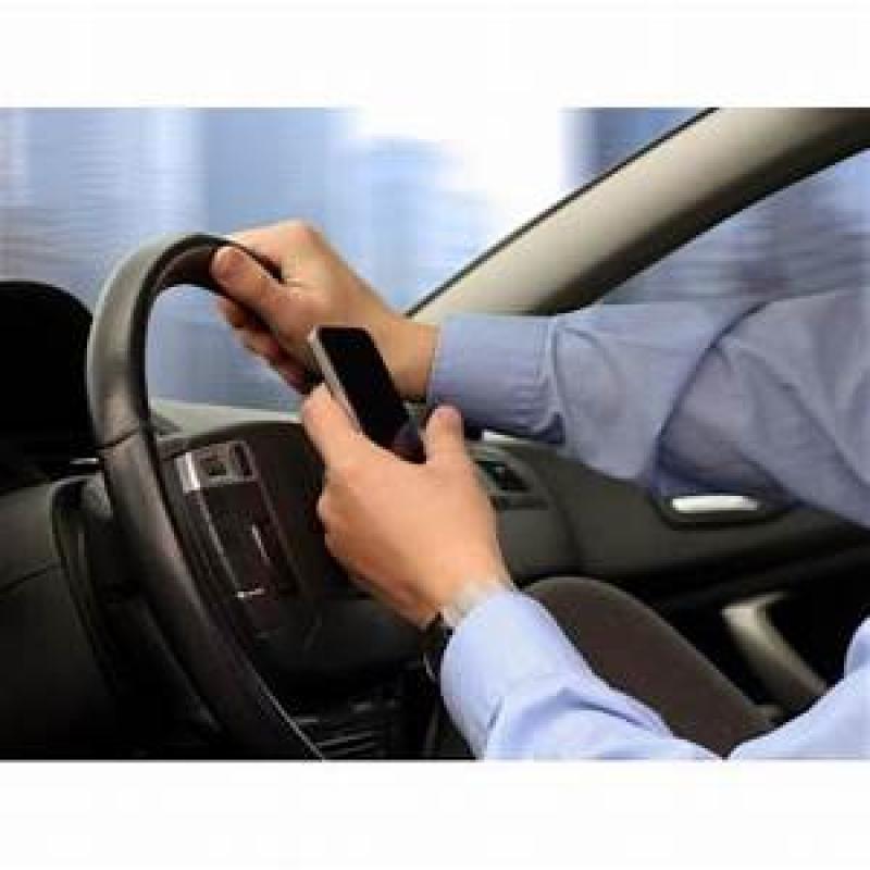 holding mobile phone while driving