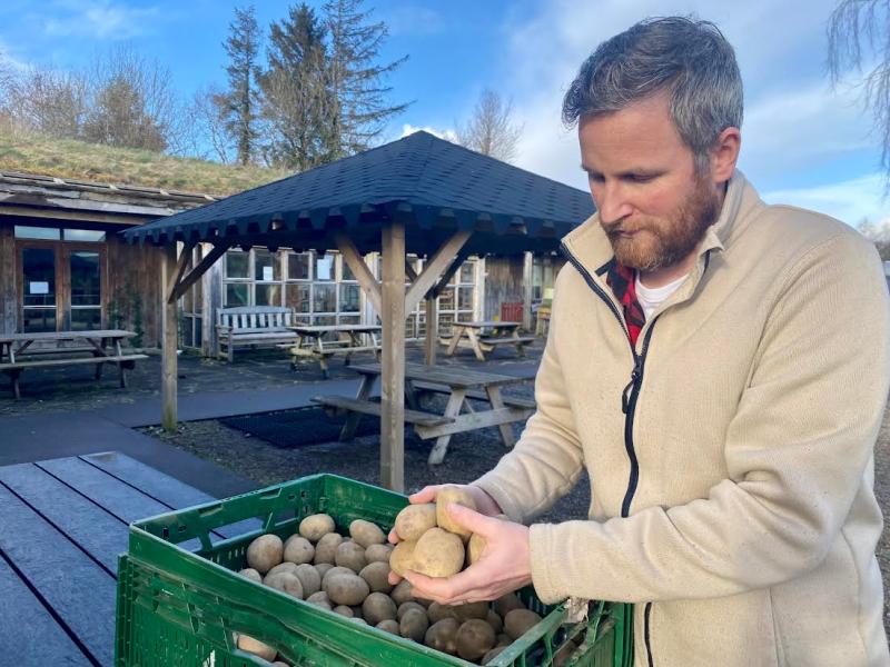 Stephen Campbell Manager of the Organic Centre with some of the large variation of potato seeds for sale at the Organic Centres Potato Day, March 3rd.