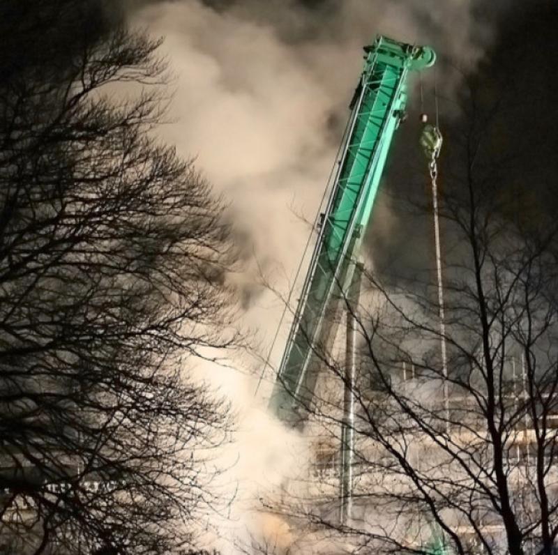 Smoke engulfs the Quinn Group crane at the Ballinamore School site last night. Gardai believe the fire was maliciously lit.