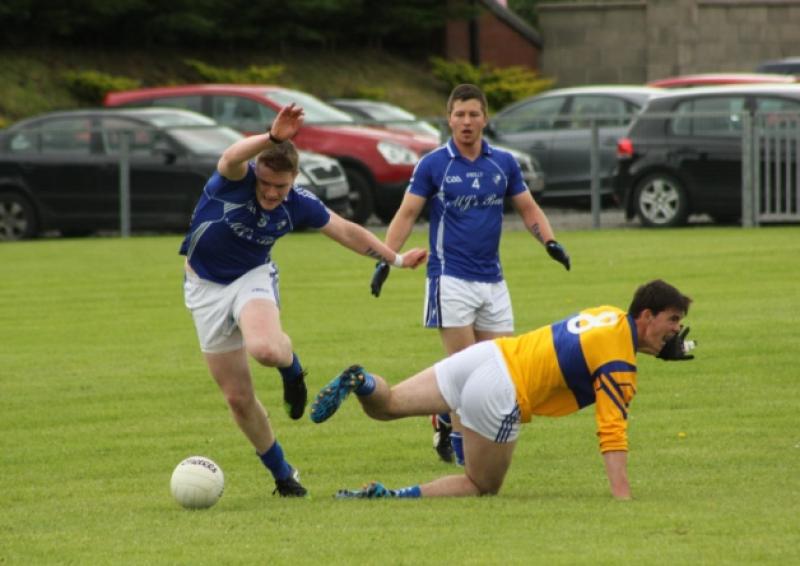 Thiernan ORourke chases after the ball with Aughawillan's Mark Plunkett on the ground in the first round of the Connacht Gold Senior Championship.