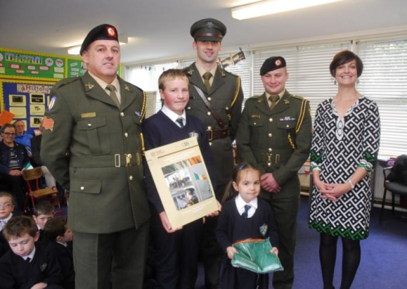 The youngest and oldest pupils at Strabraggan NS are pictured with the School Prinicpal and members of the Irish Army. From left Sgt Ozzie Hackett; Jules Davis; Lt Kevin Diffley; Isabella Yeats; Pte Niall Kilcrann and Anne White, Principal. Photo by Willie Donnellan.