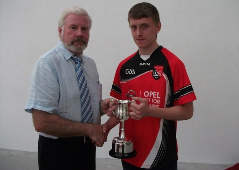 Shane Doonan is presented with the Connacht 60x30 Minor Cup by Connacht Handball Chairman Peter Heaney during the opening of Fenagh Handball Alley on Sunday August 4. Shane defeated Mayo's Darragh Cunnane on a score line of 21-12, 21-14.