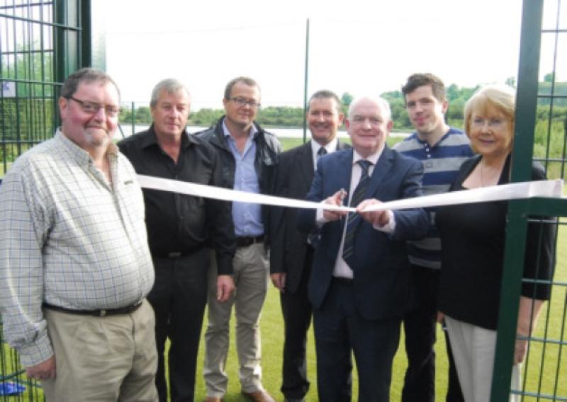 Paddy McCaul, President of the Football Association of Ireland cuts the tape to officially open the new Astra Turf Pitch in Keshcarrigan on Friday August 23rd last. Pictured from left:Councillor Francie Gilmartin, Des Foley, Michael Hennessy, Engineer A.P.D.S, Gerry Tully, Secretary, Roscommon District League, Paddy McCaul, President F.A.I, Niall Foley and Lorna McCarthy, Secretary, Keshcarrigan Development Association. Photo Willie Donnellan.