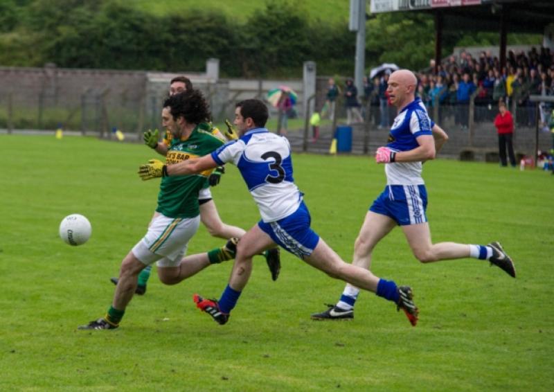 Cathal Quinn gets his shot away despite the attempted tackle from St. Mary's Barry Butler.