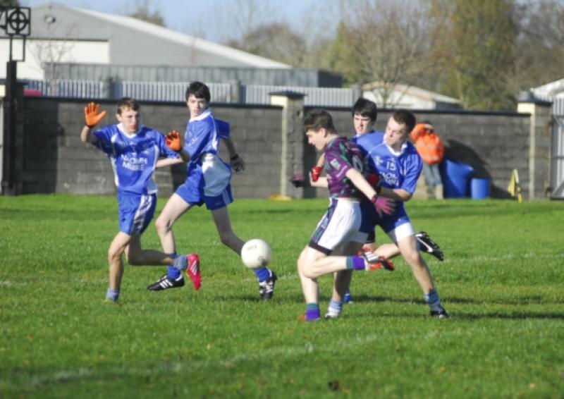 Thomas Harden shoots wide under pressure from the St. Mary's defence last Saturday in Dromod.