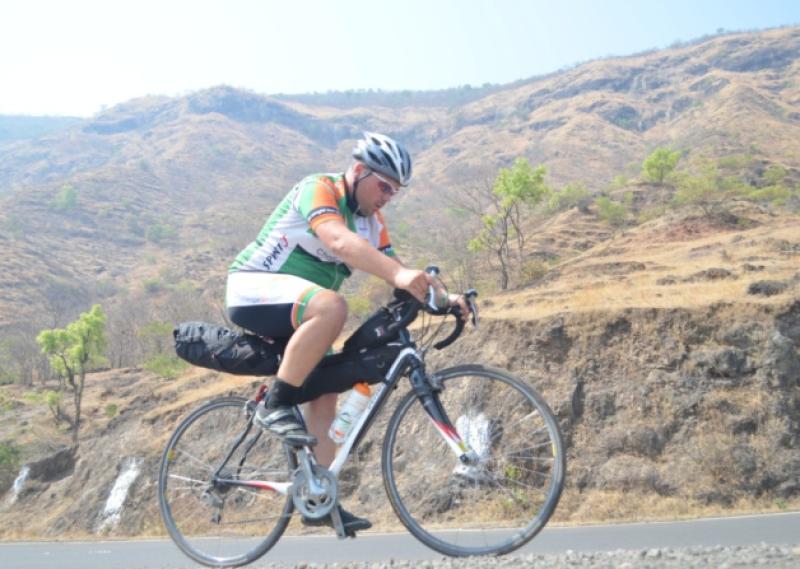 Breifne Earley pedalling through the Indian countryside.