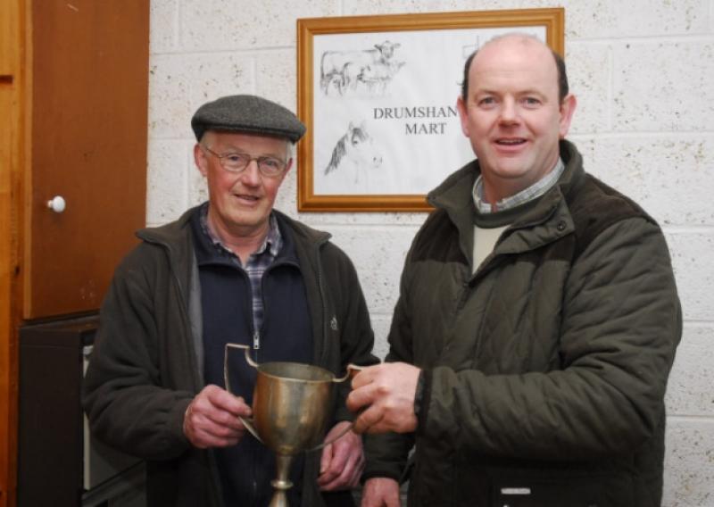 Francis Clancy, Director Drumshanbo Mart presents the second prize for the best Aberdeen Angus Bullock at Drumshanbo Mart Show & Sale to John Joe McKeon, Drumnacool, Sligo.