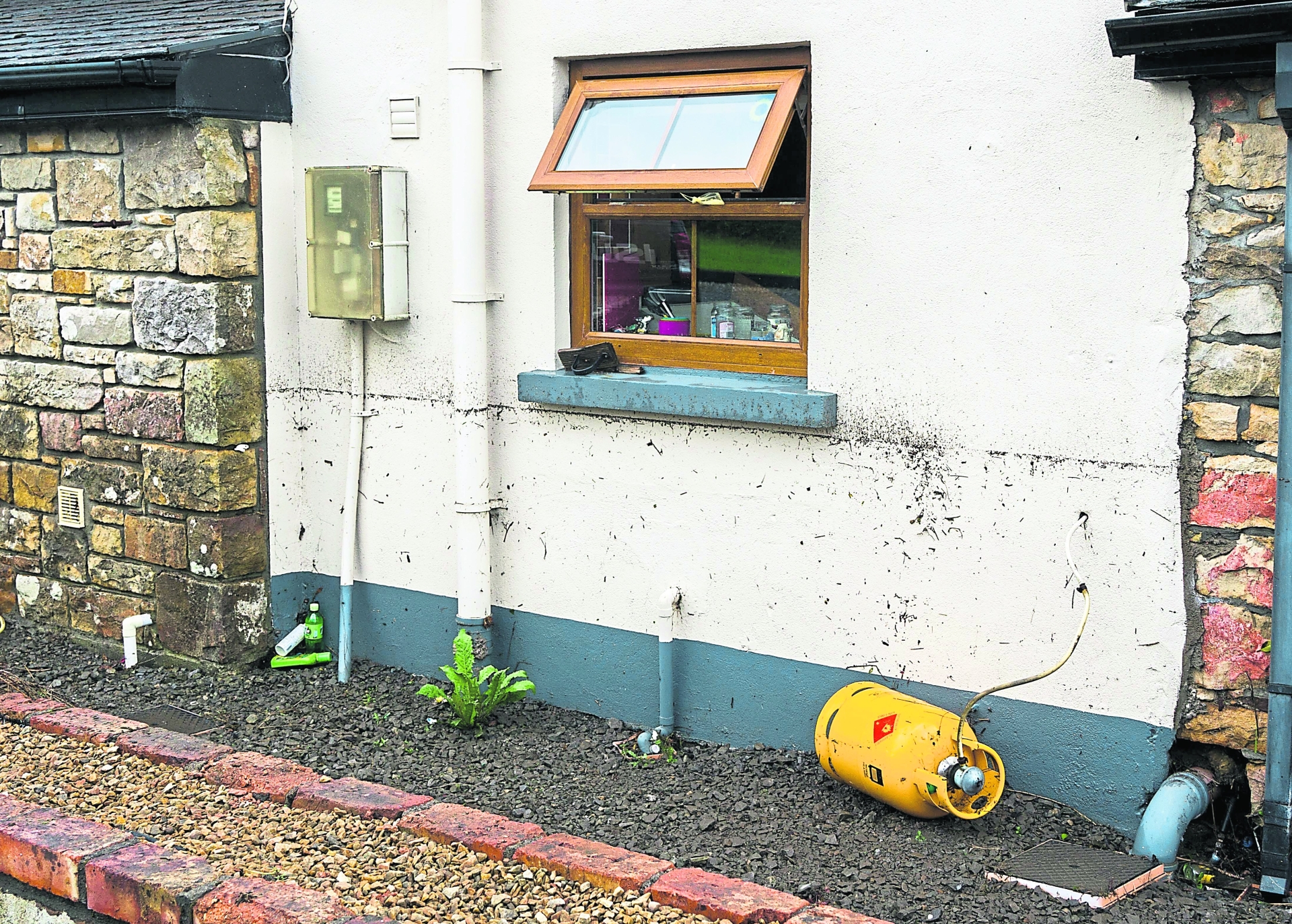 The height of the water along the outside wall in Ballinaglera. Picture Gerry Faughnan