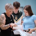 Caoimhe McGrath with mum Kate as they check over the A-Level results at St Pius College.