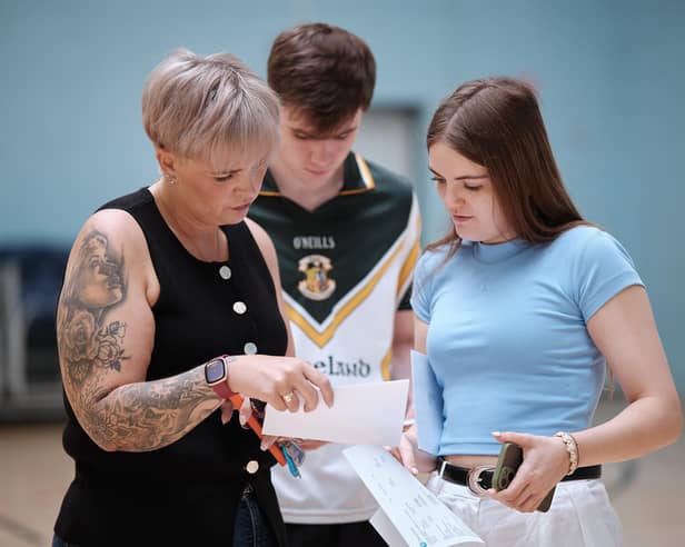 Caoimhe McGrath with mum Kate as they check over the A-Level results at St Pius College.
