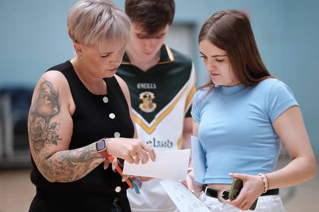 Caoimhe McGrath with mum Kate as they check over the A-Level results at St Pius College.